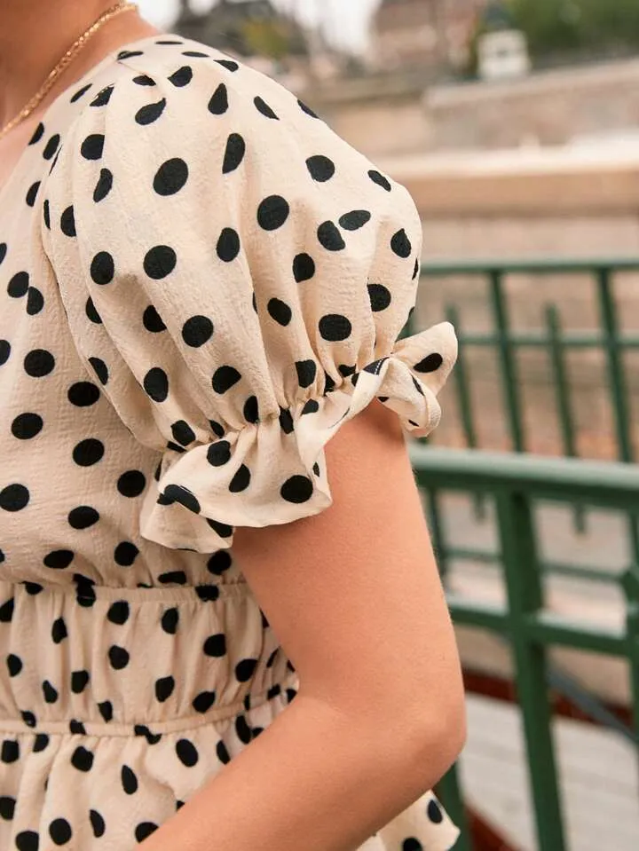 Polka dot print tie front ruffle hem blouse